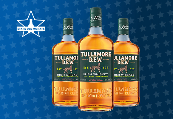 Flaschen von TULLAMORE DEW auf Sternchenhintergrund der GH Aktion Stars des Monats
