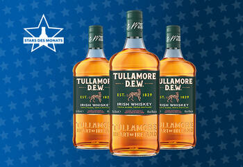 Flaschen von TULLAMORE DEW auf Sternchenhintergrund der GH Aktion Stars des Monats